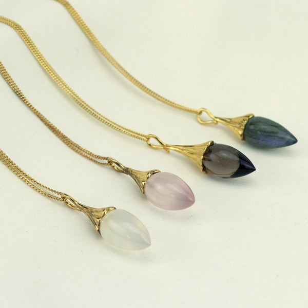 Stylish acorn pendant featuring intricate detailing, perfect for a nature-inspired accessory.