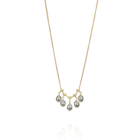 Elegant delicate adjustable grey pearl necklace, styled together for a refined look.