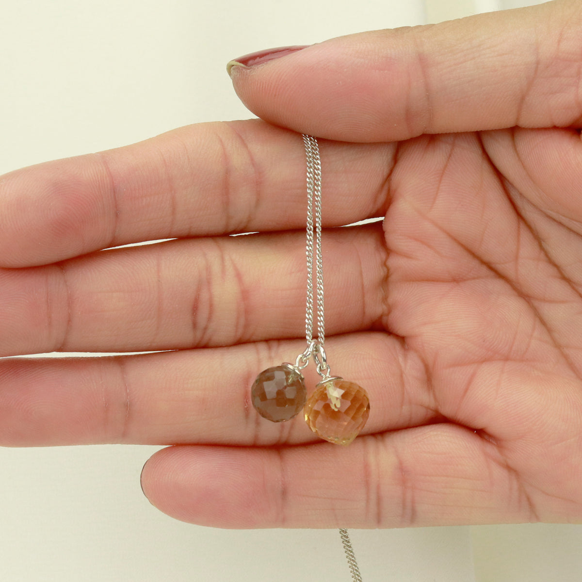Elegant double gemstone pendant designed to add a luxurious touch to any outfit.