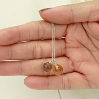 Elegant double gemstone pendant designed to add a luxurious touch to any outfit.