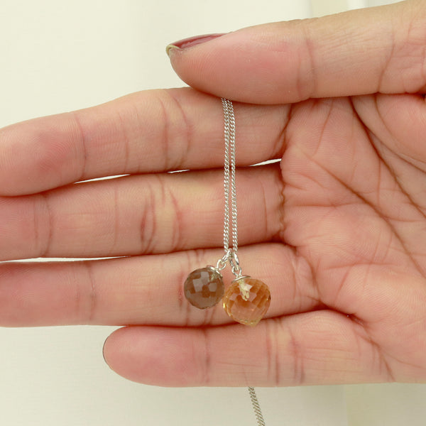 Elegant double gemstone pendant designed to add a luxurious touch to any outfit.