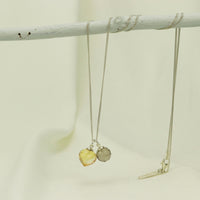 Stunning pendant featuring two complementary gemstones for a sophisticated and bold look.