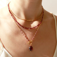 Stylish layered necklace display featuring multiple chains for a chic, modern look.