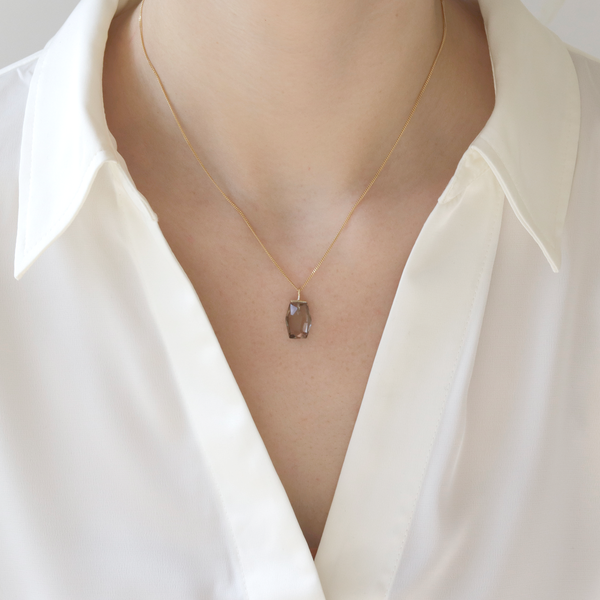 Geometric gemstone pendant, featuring a bold and modern design with striking gemstones, perfect for adding a contemporary touch to any outfit.