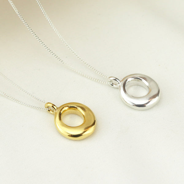Stunning halo pendant with a radiant gemstone, offering a refined and elegant accessory for any occasion.