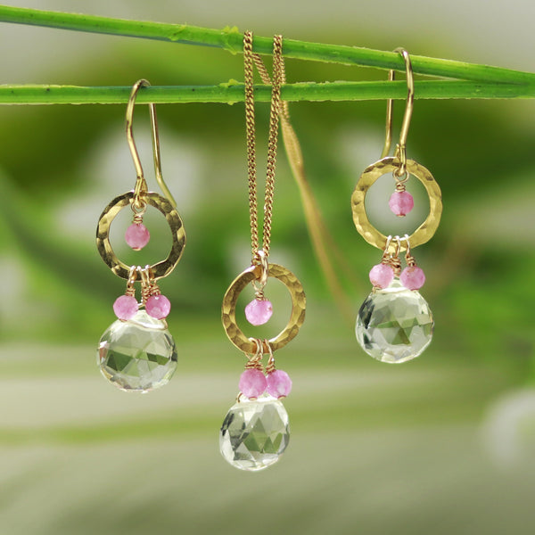 Style shot featuring hammered circle gem drop earrings and necklace with green amethyst gemstones.