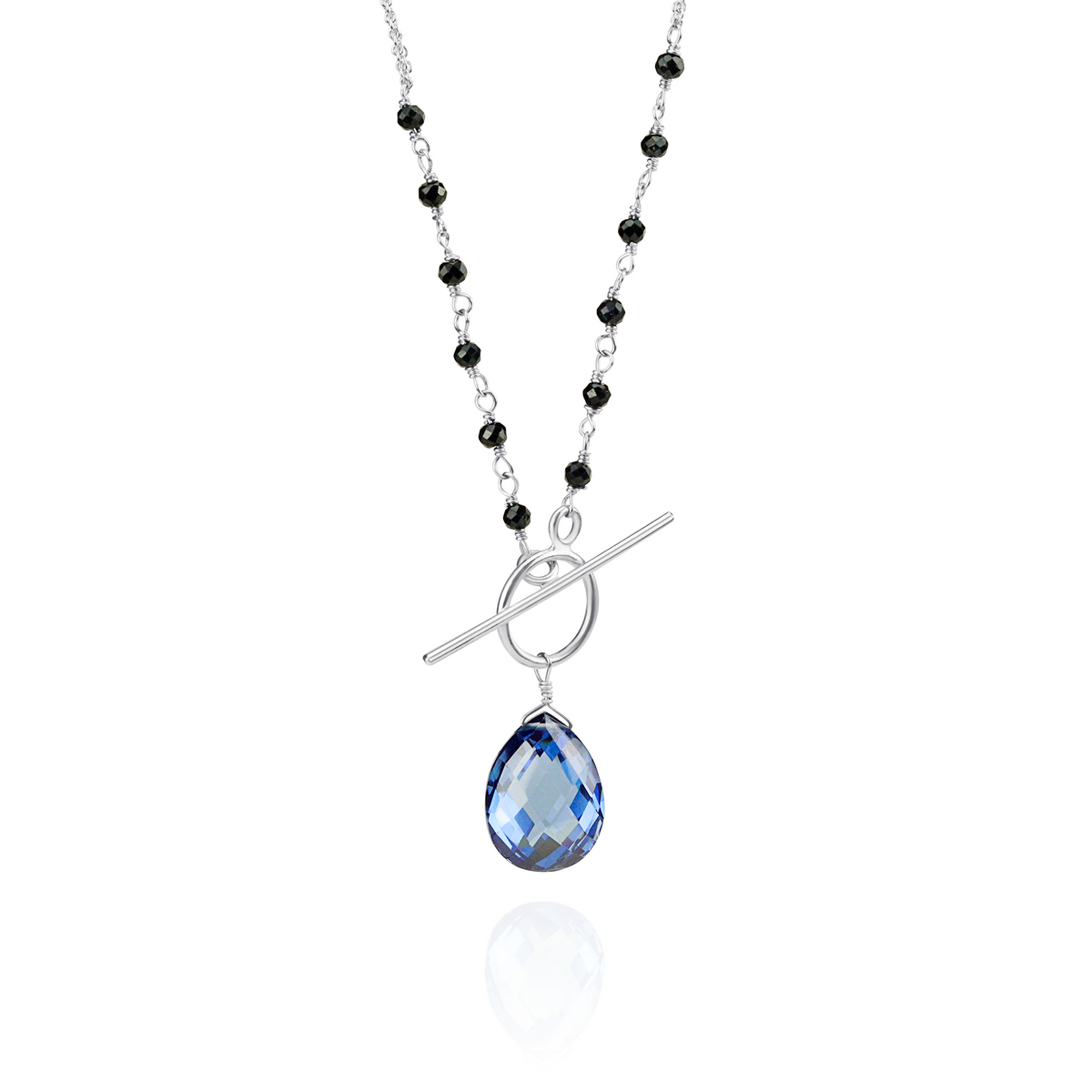 Stunning sapphire and pear-shaped tanzanite zircon toggle pendant with a sophisticated design.