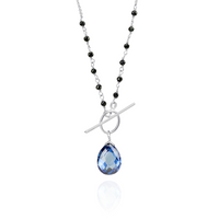 Stunning sapphire and pear-shaped tanzanite zircon toggle pendant with a sophisticated design.