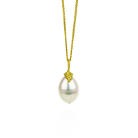Elegant single pearl necklace with a textured feature, adding a touch of sophistication.