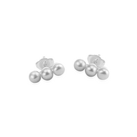 Delicate small triple pearl studs with a gold-plated finish, perfect for adding a touch of elegance to any outfit.