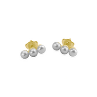 Elegant small triple pearl studs with gold plating, offering a refined and timeless style.