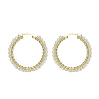 Elegant white pearl drop earrings designed for timeless sophistication.