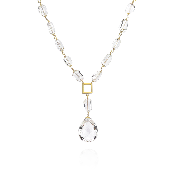 Long necklace with tumbled rock crystal gemstones, featuring an elegant minimalist design.